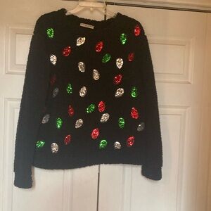 A fuzzy warm cropped Christmas Top..  sequined little lights on the Front